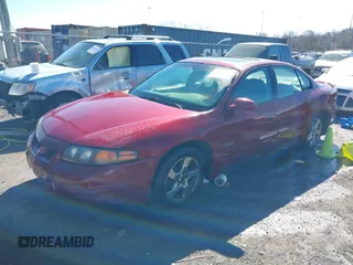2003 Pontiac Bonneville SLE z VIN 1G2HY52K534159881, wystawiony jako IAAI lot #41604988 z przebiegiem 227 097 mil mil oraz . Historia ofert i sprzedaży dostępna na DreamBid. Obrazek 2.