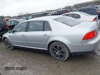 2005 Volkswagen Phaeton z VIN WVWBH03D858004483, wystawiony jako IAAI lot #41412475 z przebiegiem 146 072 mil mil oraz . Historia ofert i sprzedaży dostępna na DreamBid. Obrazek 14.