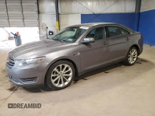 2014 Ford Taurus Limited with VIN 1FAHP2F8XEG102658, listed as a Copart auction lot 63368935 with 115,306 mi miles and Salvage title. Bid and sale history available at DreamBid. Image 1.