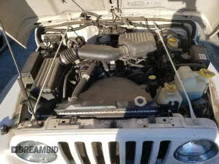 2002 Jeep Wrangler SE with VIN 1J4FA29P82P756330, listed as a Copart auction lot 83659574 with 156,901 mi miles and Salvage Title. Bid and sale history available at DreamBid. Image 12.