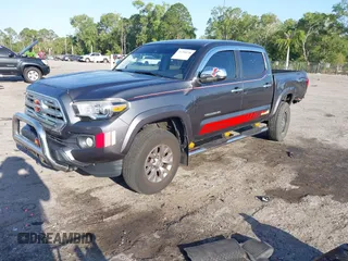 2018 Toyota Tacoma SR5 with VIN 3TMAZ5CN4JM069965, listed as a IAAI auction lot 41798238 with 124,619 mi miles and . Bid and sale history available at DreamBid. Image 2.
