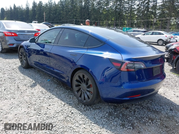 2021 Tesla Model 3 Performance with VIN 5YJ3E1EC1MF000961, listed as a IAAI auction lot 42110524 with 31,890 mi miles and . Bid and sale history available at carsss.com. Image 3.