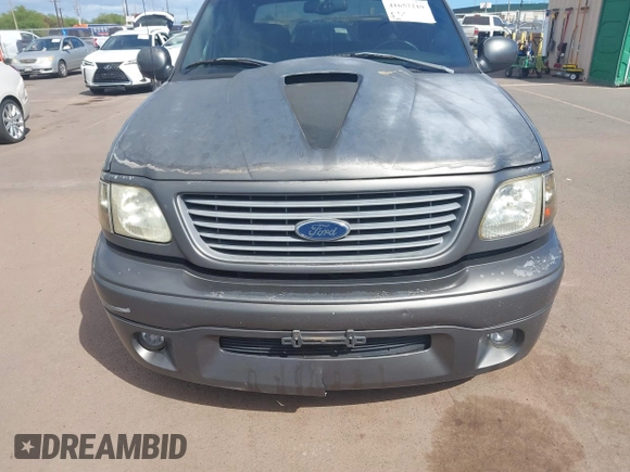 2002 Ford F-150 Harley Davidson with VIN 1FTRW07312KC88379, listed as a IAAI auction lot 41657219 with 1 mi miles. Bid and sale history available at carsss.com. Image 6.
