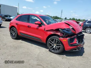 2023 Porsche Macan with VIN WP1AA2A54PLB07597, listed as a Copart auction lot 64077345 with 50,704 mi miles and Salvage title. Bid and sale history available at DreamBid. Image 4.