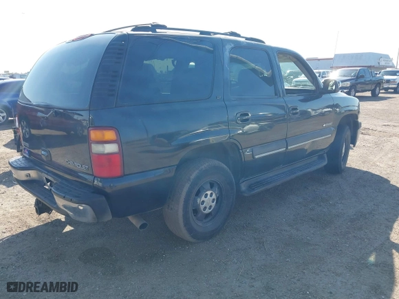 2003 Chevrolet Tahoe LT with VIN 1GNEC13Z33R166971, listed as a IAAI auction lot 41356669 with 318,527 mi miles. Bid and sale history available at carsss.com. Image 4.