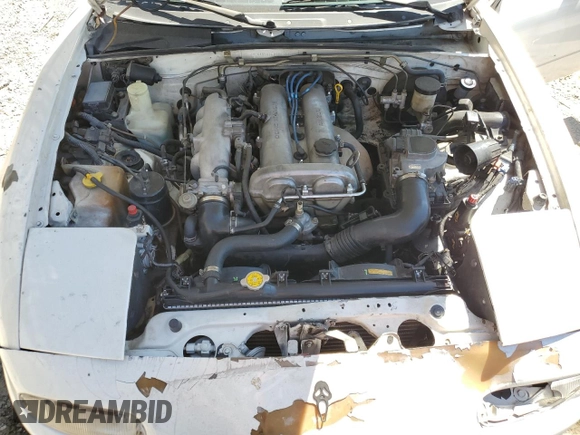 1990 Mazda MX-5 Miata z VIN JM1NA3511L0106323, wystawiony jako Copart lot #50449685 z przebiegiem 179 018 mil mil oraz Szkoda całkowita • Salvage title. Historia ofert i sprzedaży dostępna na DreamBid. Obrazek 11.