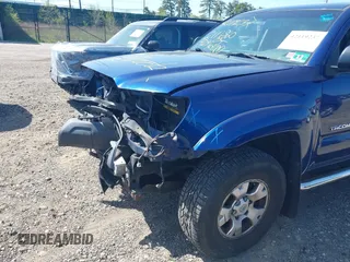 2014 Toyota Tacoma with VIN 3TMLU4EN4EM154261, listed as a IAAI auction lot 42119237 with 211,929 mi miles and . Bid and sale history available at DreamBid. Image 12.