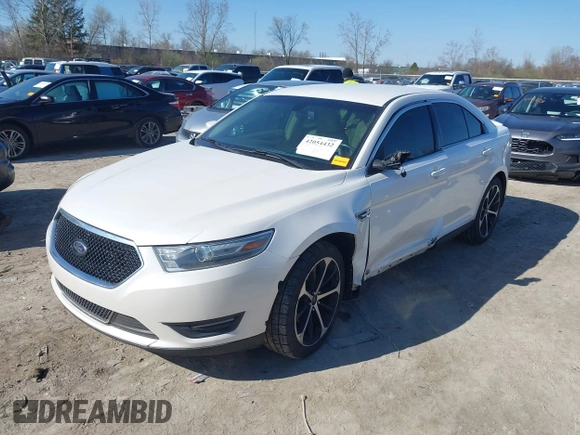 2014 Ford Taurus SEL z VIN 1FAHP2E81EG104137, wystawiony jako IAAI lot #42054432 z przebiegiem 146 046 mil mil oraz . Historia ofert i sprzedaży dostępna na DreamBid. Obrazek 2.