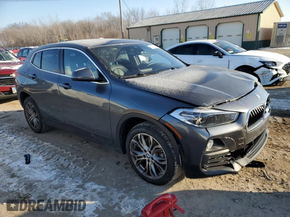 2020 BMW X2 xDrive28i with VIN WBXYJ1C00L5P51384, listed as a Copart auction lot 87406814 with 52,807 mi miles and Salvage Title. Bid and sale history available at carsss.com. Image 4.
