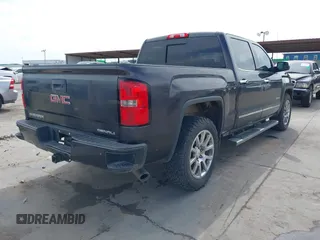 2015 GMC Sierra 1500 Denali with VIN 3GTU2WEJ2FG509236, listed as a IAAI auction lot 41771790 with 219,043 mi miles. Bid and sale history available at carsss.com. Image 4.