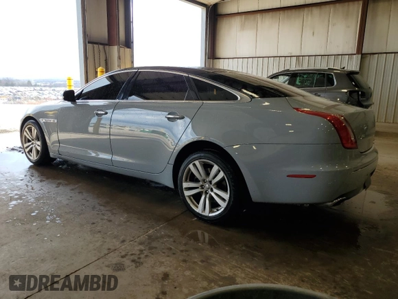 2013 Jaguar XJ with VIN SAJWJ1CD1D8V51462, listed as a Copart auction lot 50527985 with 62,995 mi miles and Salvage title. Bid and sale history available at DreamBid. Image 2.