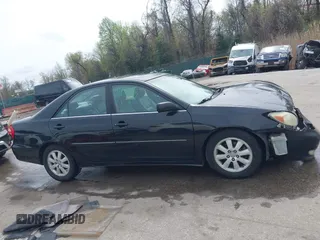 2004 Toyota Camry LE with VIN 4T1BF30K34U080477, listed as a IAAI auction lot 41956998 with 135,441 mi miles. Bid and sale history available at carsss.com. Image 13.