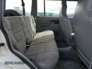 1995 Jeep Cherokee Sport z VIN 1J4FJ68S8SL650142, wystawiony jako Copart lot #51923775 z przebiegiem 329 796 mil mil oraz Czysty tytuł • Clean title. Historia ofert i sprzedaży dostępna na DreamBid. Obrazek 11.