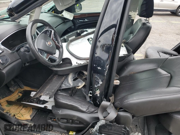 2014 Cadillac SRX Premium Collection z VIN 3GYFNGE31ES688270, wystawiony jako Copart lot #52795245 z przebiegiem 134 103 mil mil oraz Szkoda całkowita • Salvage title. Historia ofert i sprzedaży dostępna na DreamBid. Obrazek 7.
