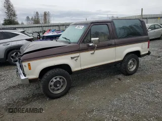 1986 Ford Bronco z VIN 1FMCU14T1GUB14387, wystawiony jako Copart lot #76962214 z przebiegiem 785 536 mil mil oraz Szkoda całkowita • Salvage title. Historia ofert i sprzedaży dostępna na DreamBid. Obrazek 1.