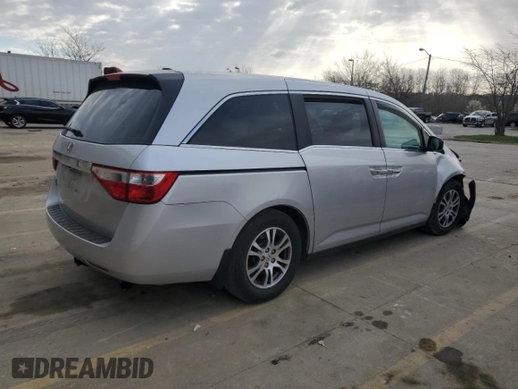2012 Honda Odyssey EX-L with VIN 5FNRL5H60CB117376, listed as a Copart auction lot 50740725 with 163,716 mi miles and Salvage Title. Bid and sale history available at DreamBid. Image 3.