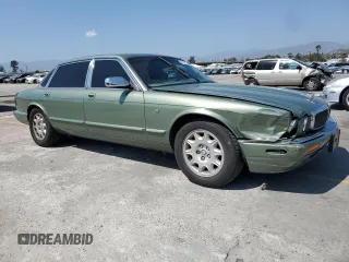 1999 Jaguar XJ with VIN SAJHX604XXC854217, listed as a Copart auction lot 56042735 with 127,092 mi miles and Salvage title. Bid and sale history available at DreamBid. Image 4.