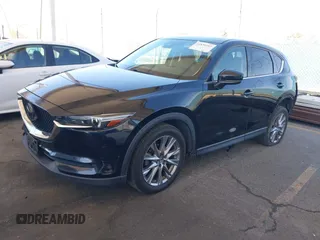 2020 Mazda CX-5 Grand Touring z VIN JM3KFADMXL0740144, wystawiony jako IAAI lot #41830203 z przebiegiem 70 535 mil mil oraz . Historia ofert i sprzedaży dostępna na DreamBid. Obrazek 2.