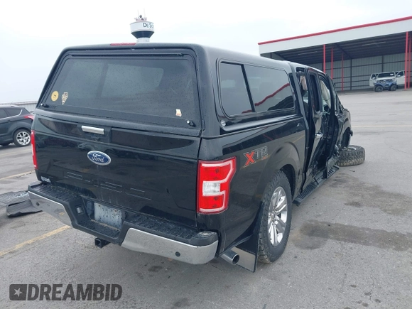 2018 Ford F-150 XL with VIN 1FTEW1E5XJKC37082, listed as a IAAI auction lot 42335721 with 167,401 mi miles and . Bid and sale history available at DreamBid. Image 4.