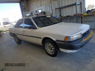 1991 Toyota Camry z VIN 4T1SV24E0MU402588, wystawiony jako Copart lot #82920114 z przebiegiem 124 644 mil mil oraz Szkoda całkowita • Salvage title. Historia ofert i sprzedaży dostępna na DreamBid. Obrazek 4.