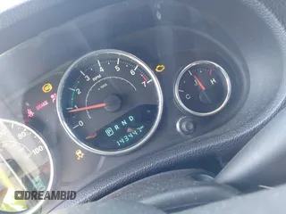 2014 Jeep Wrangler Unlimited Sport with VIN 1C4BJWDG4EL295044, listed as a IAAI auction lot 41997837 with 143,447 mi miles. Bid and sale history available at carsss.com. Image 15.