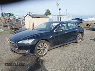 2014 Tesla Model S 60 with VIN 5YJSA1H12EFP53787, listed as a IAAI auction lot 42279493 with 168,859 mi miles and . Bid and sale history available at DreamBid. Image 2.