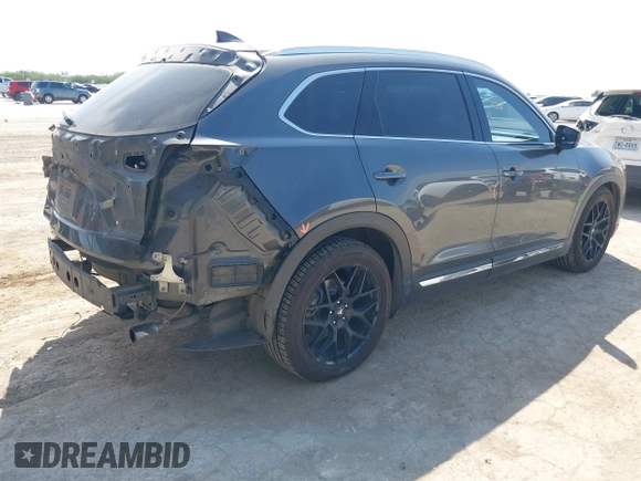 2016 Mazda CX-9 Grand Touring with VIN JM3TCADY5G0120033, listed as a IAAI auction lot 42248488 with 150,044 mi miles and . Bid and sale history available at DreamBid. Image 4.