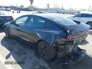 2024 Tesla Model 3 with VIN 5YJ3E1EA7RF717855, listed as a IAAI auction lot 41838814 with 8,750 mi miles and . Bid and sale history available at DreamBid. Image 3.
