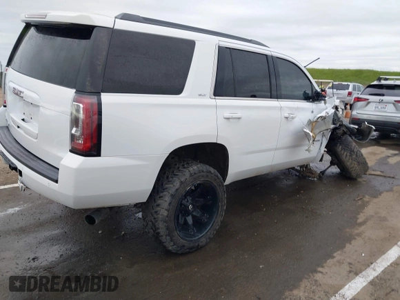 2019 GMC Yukon SLT with VIN 1GKS2BKC1KR167766, listed as a IAAI auction lot 41902532 with 97,793 mi miles. Bid and sale history available at carsss.com. Image 4.