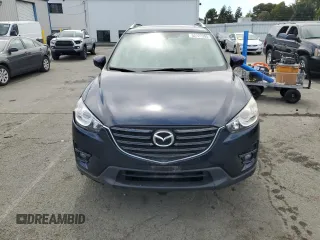 2016 Mazda CX-5 Grand Touring with VIN JM3KE4DY4G0750939, listed as a Copart auction lot 52727395 with 72,428 mi miles and Salvage Title. Bid and sale history available at carsss.com. Image 5.
