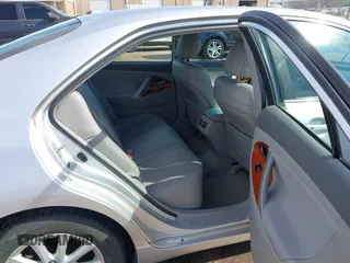 2010 Toyota Camry with VIN 4T4BF3EK5AR083939, listed as a IAAI auction lot 41882869 with 124,405 mi miles and . Bid and sale history available at DreamBid. Image 8.