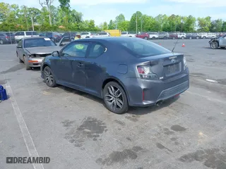 2015 Scion tC with VIN JTKJF5C71FJ013747, listed as a IAAI auction lot 42087740 with 138,097 mi miles. Bid and sale history available at carsss.com. Image 3.