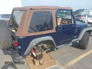 2002 Jeep Wrangler Sport with VIN 1J4FA49S72P729703, listed as a IAAI auction lot 42468446 with 164,342 mi miles and . Bid and sale history available at DreamBid. Image 6.