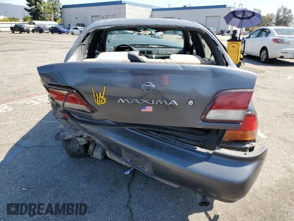 1999 Nissan Maxima GXE z VIN JN1CA21D9XM409448, wystawiony jako Copart lot #51822895 z przebiegiem Nie podano mil oraz Szkoda całkowita • Salvage title. Historia ofert i sprzedaży dostępna na DreamBid. Obrazek 6.