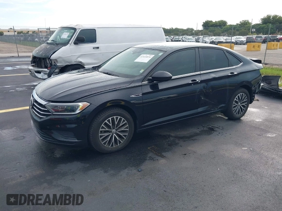 2019 Volkswagen Jetta SEL z VIN 3VWEB7BU2KM273950, wystawiony jako IAAI lot #42414034 z przebiegiem 84 100 mil mil oraz . Historia ofert i sprzedaży dostępna na DreamBid. Obrazek 2.