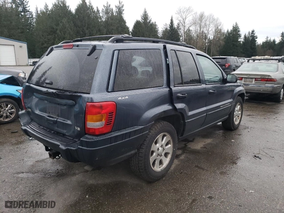 2001 Jeep Grand Cherokee Laredo with VIN 1J4GW48N91C560288, listed as a Copart auction lot 87030774 with 157,544 mi miles and Salvage Title. Bid and sale history available at carsss.com. Image 3.