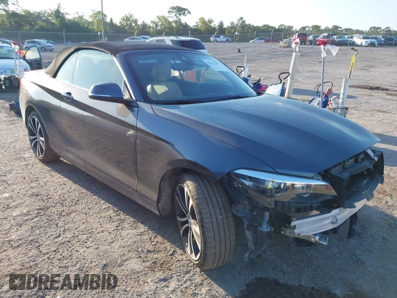 2020 BMW 2 Series 230i xDrive with VIN WBA2K1C08L7G28887, listed as a IAAI auction lot 42122785 with 30,599 mi miles and . Bid and sale history available at carsss.com. Image 1.