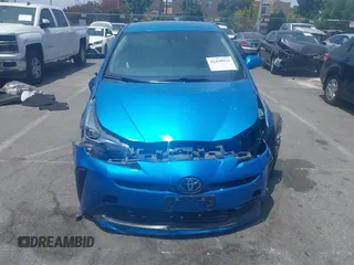 2021 Toyota Prius L Eco with VIN JTDKAMFUXM3134462, listed as a IAAI auction lot 42450931 with 89,239 mi miles and . Bid and sale history available at DreamBid. Image 12.