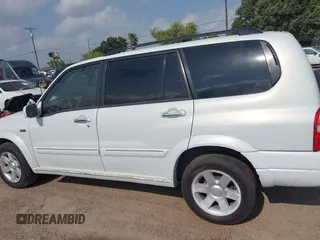 2003 Suzuki XL7 Touring z VIN JS3TY92V534106381, wystawiony jako IAAI lot #42063755 z przebiegiem 190 917 mil mil oraz . Historia ofert i sprzedaży dostępna na DreamBid. Obrazek 14.