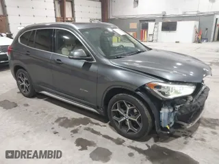 2016 BMW X1 xDrive28i with VIN WBXHT3C3XG5E47536, listed as a IAAI auction lot 41672144 with 97,932 mi miles. Bid and sale history available at carsss.com. Image 1.