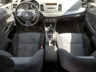 2009 Mitsubishi Lancer z VIN JA3AX88W99U613116, wystawiony jako Copart lot #58765855 z przebiegiem 256 289 mil mil oraz Czysty tytuł • Clean title. Historia ofert i sprzedaży dostępna na DreamBid. Obrazek 8.