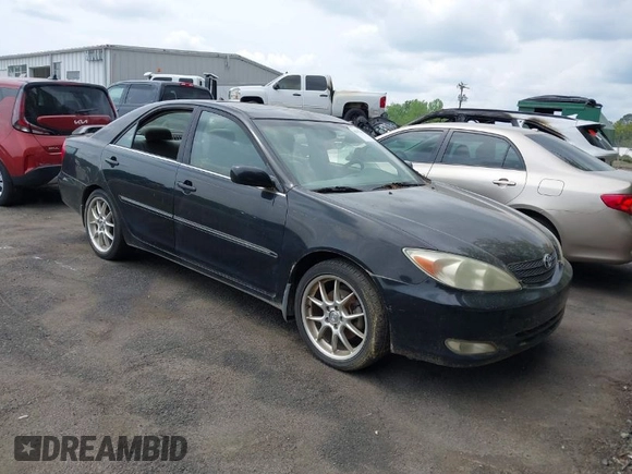 2003 Toyota Camry LE with VIN JTDBF32K430146557, listed as a IAAI auction lot 42102454 with 179,653 mi miles. Bid and sale history available at carsss.com. Image 1.