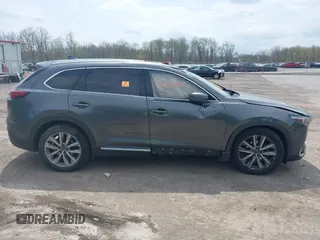 2016 Mazda CX-9 Grand Touring with VIN JM3TCBDY3G0117802, listed as a IAAI auction lot 42150821 with 157,760 mi miles and . Bid and sale history available at DreamBid. Image 13.