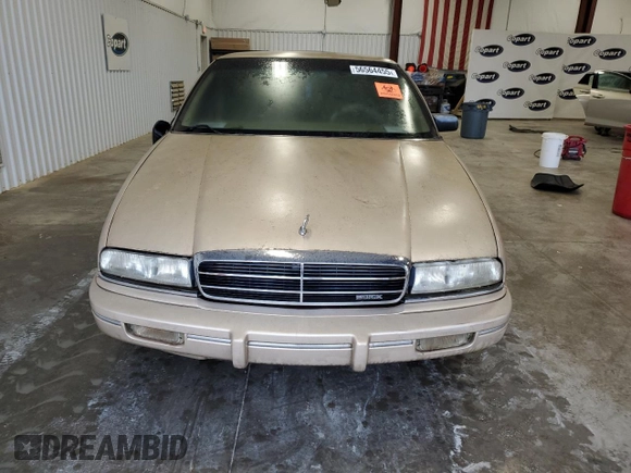 1993 Buick Regal Custom with VIN 2G4WB54L4P1411904, listed as a Copart auction lot 56564455 with 112,248 mi miles and Salvage title. Bid and sale history available at DreamBid. Image 5.