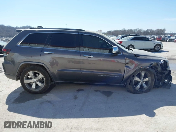2015 Jeep Grand Cherokee Overland with VIN 1C4RJECT2FC648292, listed as a IAAI auction lot 41806402 with 116,766 mi miles. Bid and sale history available at carsss.com. Image 14.