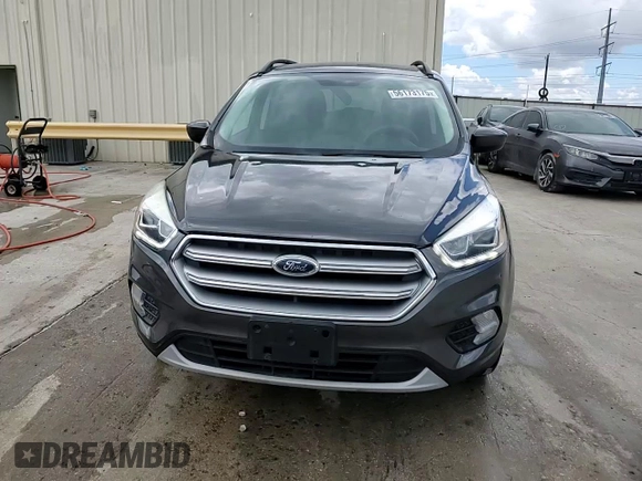 2017 Ford Escape SE z VIN 1FMCU9G91HUE17654, wystawiony jako Copart lot #56173175 z przebiegiem 97 678 mil mil oraz Czysty tytuł • Clean title. Historia ofert i sprzedaży dostępna na DreamBid. Obrazek 14.