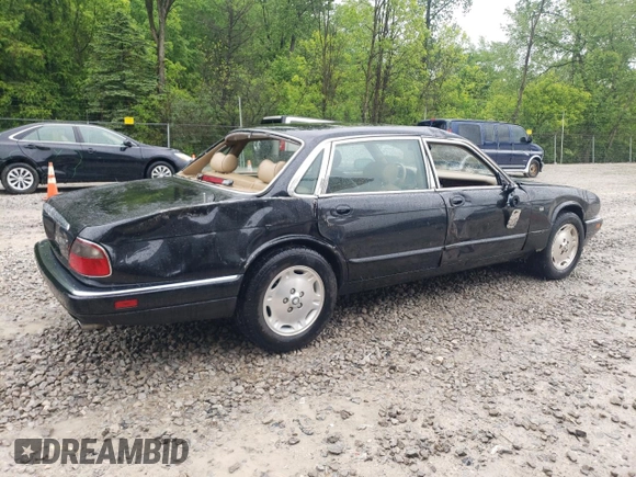 1997 Jaguar XJ with VIN SAJHX6248VC806189, listed as a Copart auction lot 57891035 with 51,654 mi miles and Salvage title. Bid and sale history available at DreamBid. Image 3.