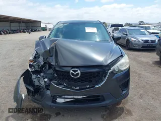 2014 Mazda CX-5 Sport with VIN JM3KE2BE0E0411377, listed as a IAAI auction lot 42143229 with 137,384 mi miles and . Bid and sale history available at carsss.com. Image 12.