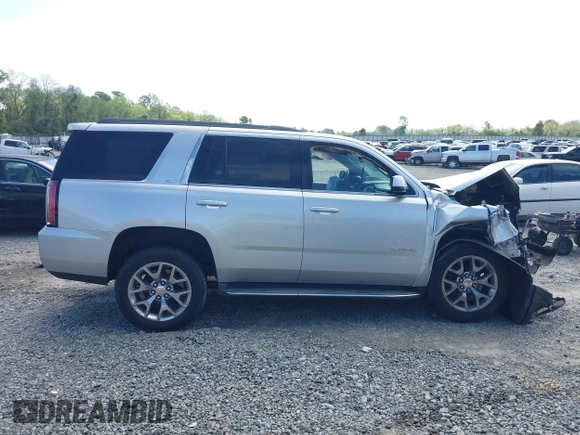 2015 GMC Yukon SLT z VIN 1GKS2BKC0FR100064, wystawiony jako IAAI lot #41941462 z przebiegiem 136 740 mil mil oraz . Historia ofert i sprzedaży dostępna na DreamBid. Obrazek 13.
