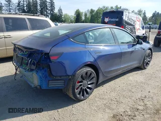 2023 Tesla Model 3 Performance with VIN 5YJ3E1EC2PF679613, listed as a IAAI auction lot 42099199 with 21,721 mi miles. Bid and sale history available at carsss.com. Image 4.